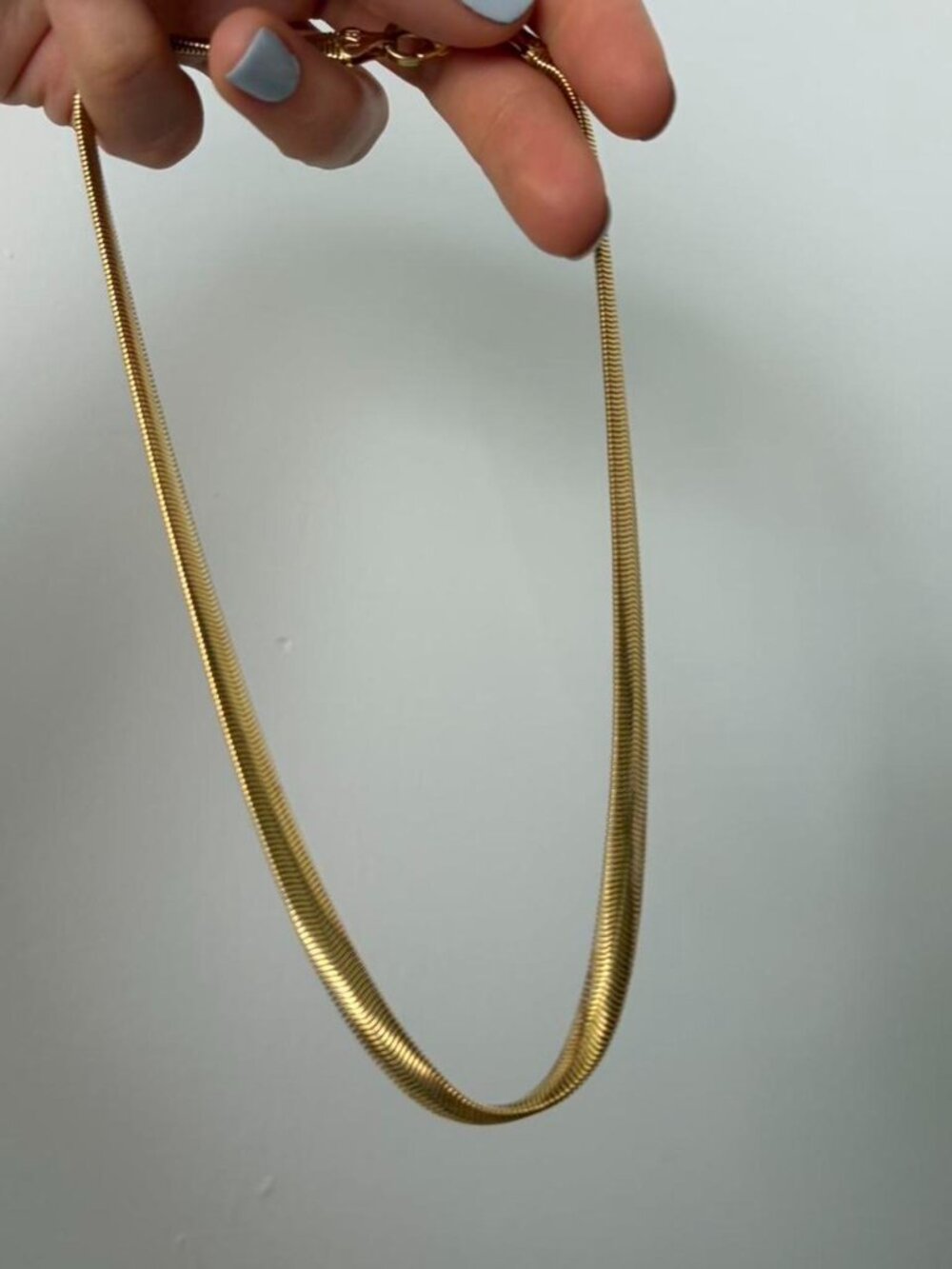 Gold colored chain necklace